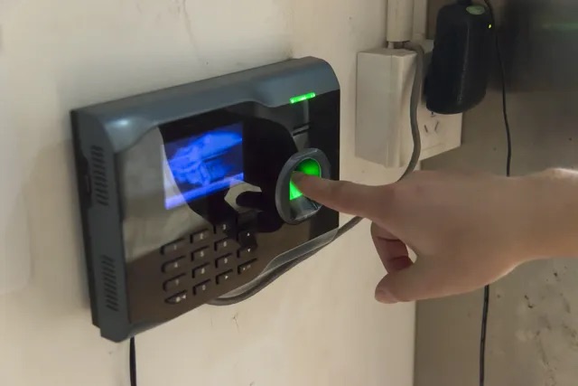 A person is touching the screen of a device.